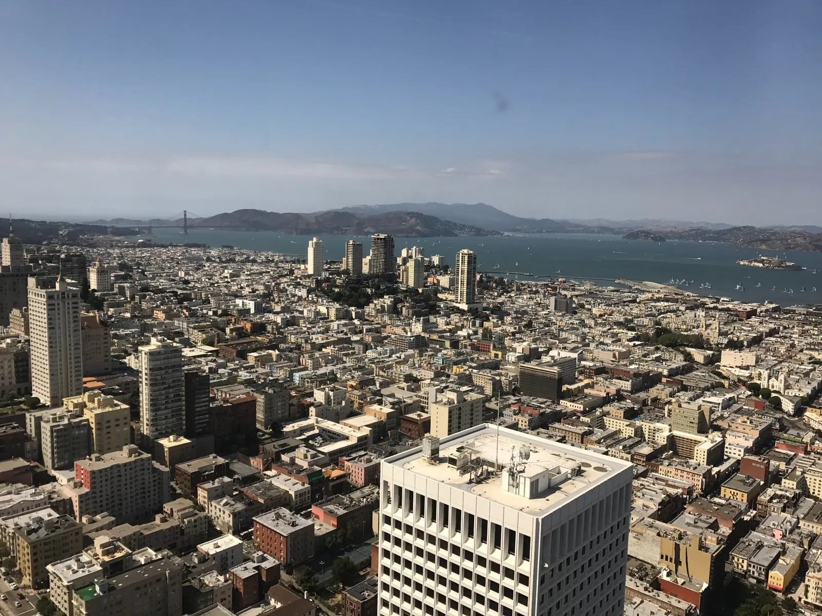 San Francisco rooftops with the bay, Golden Gate Bridge and distant hills